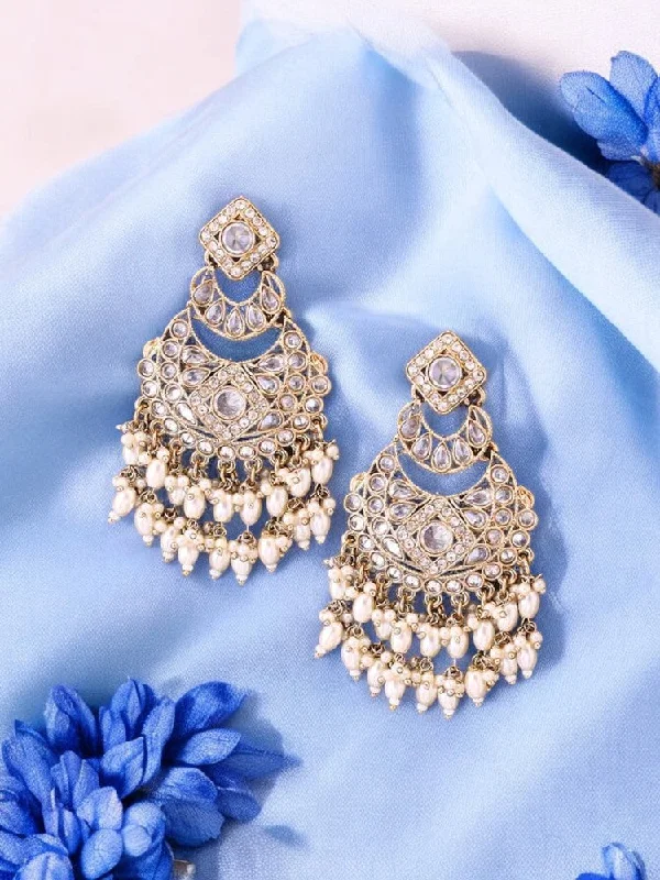 women stacking earrings -Ivory Nila Chandbalis